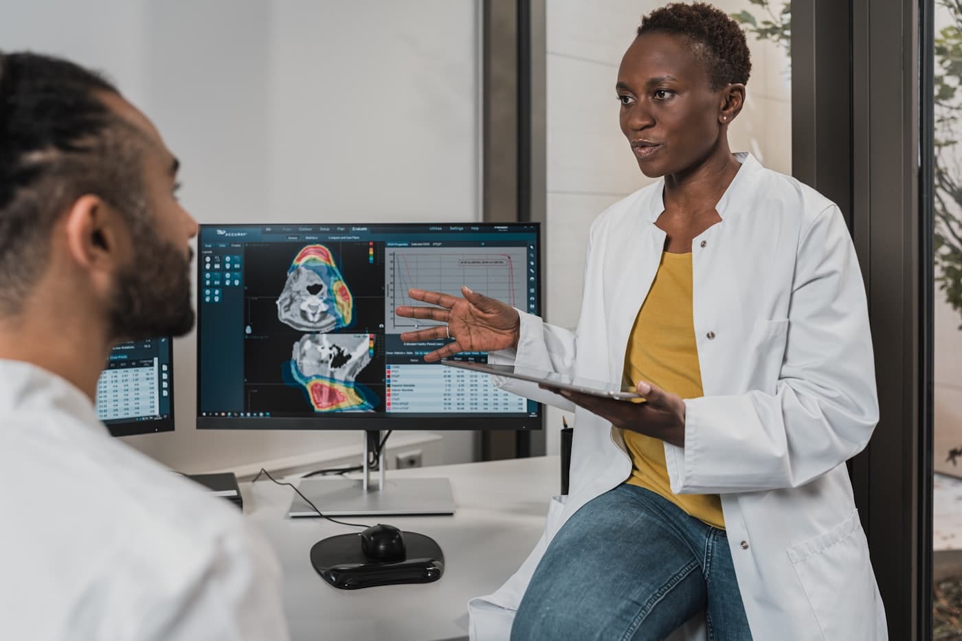 MedNova specialist reviewing medical imaging results with a clinician